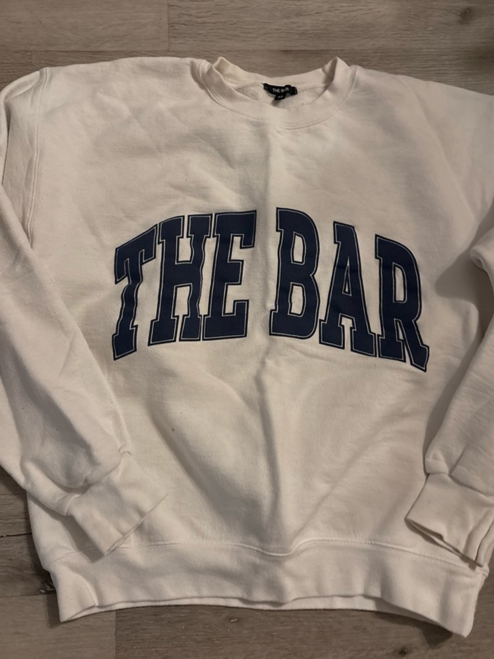 The Bar White Crewneck Sweatshirt with Navy Arch Logo